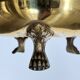 Hollywood Regency style umbrella stand, brass finish and lio pattern.