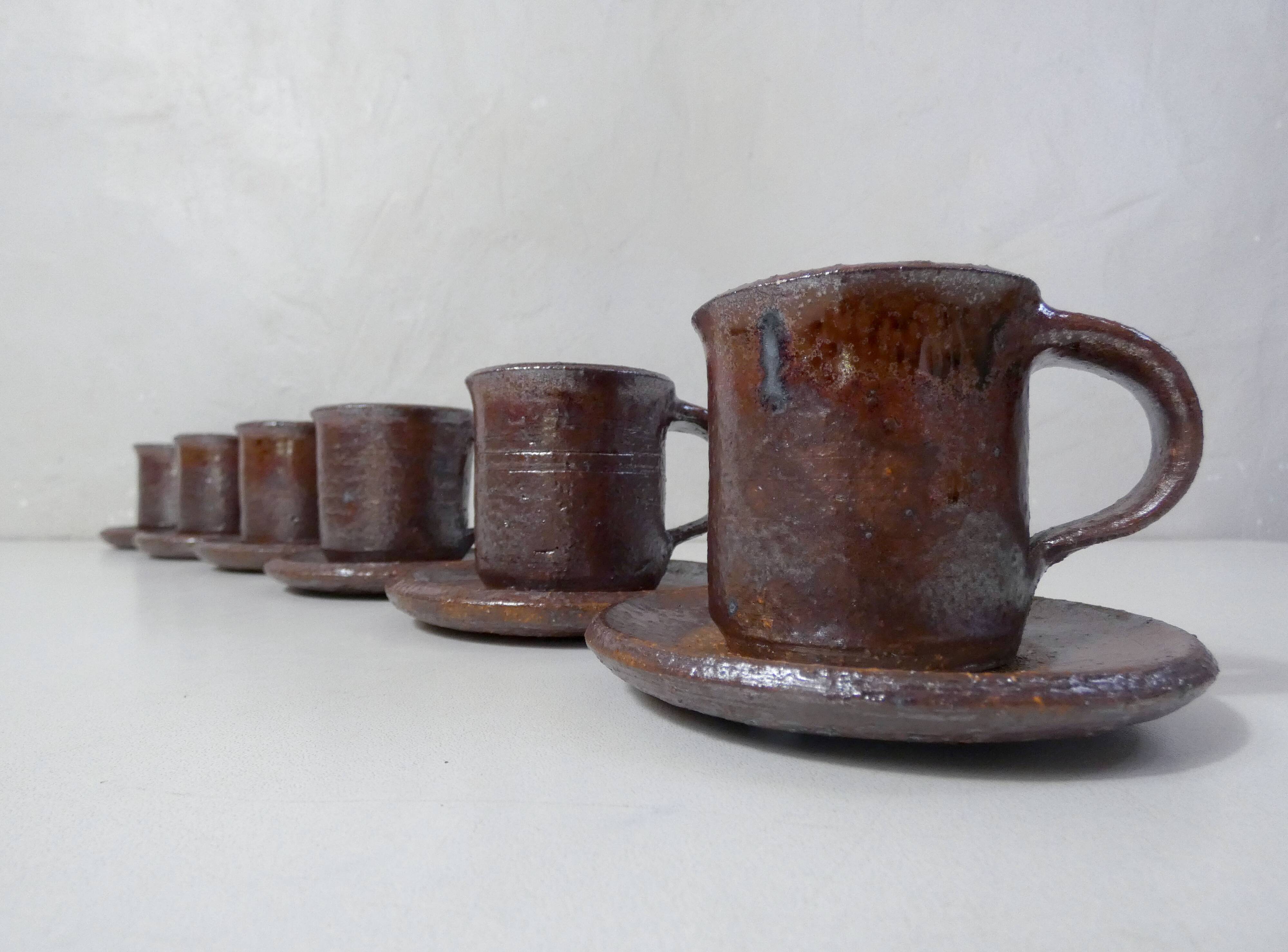 coffee service in iridescent stoneware cups and vintage sugar bowl