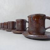 coffee service in iridescent stoneware cups and vintage sugar bowl