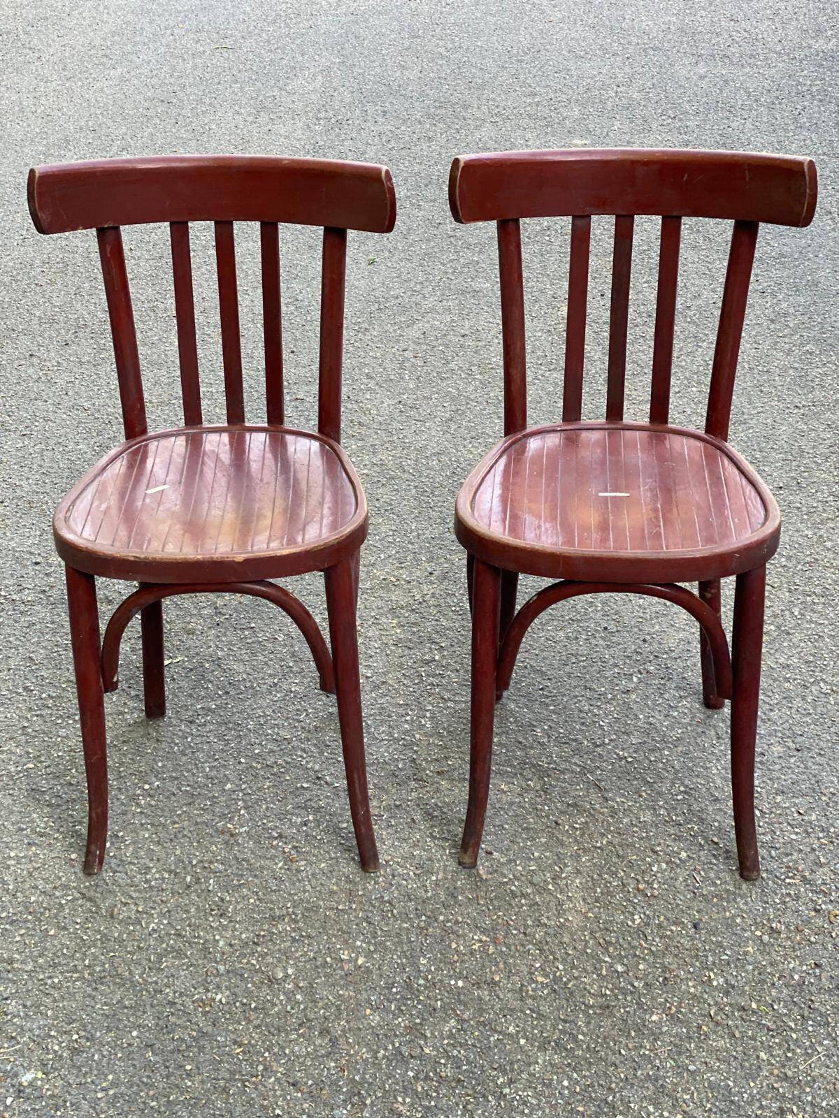 2 burgundy curved wooden bistro chairs from Ets Joseph Levallois