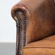 Vintage club chair in sheepskin leather with a characterful look