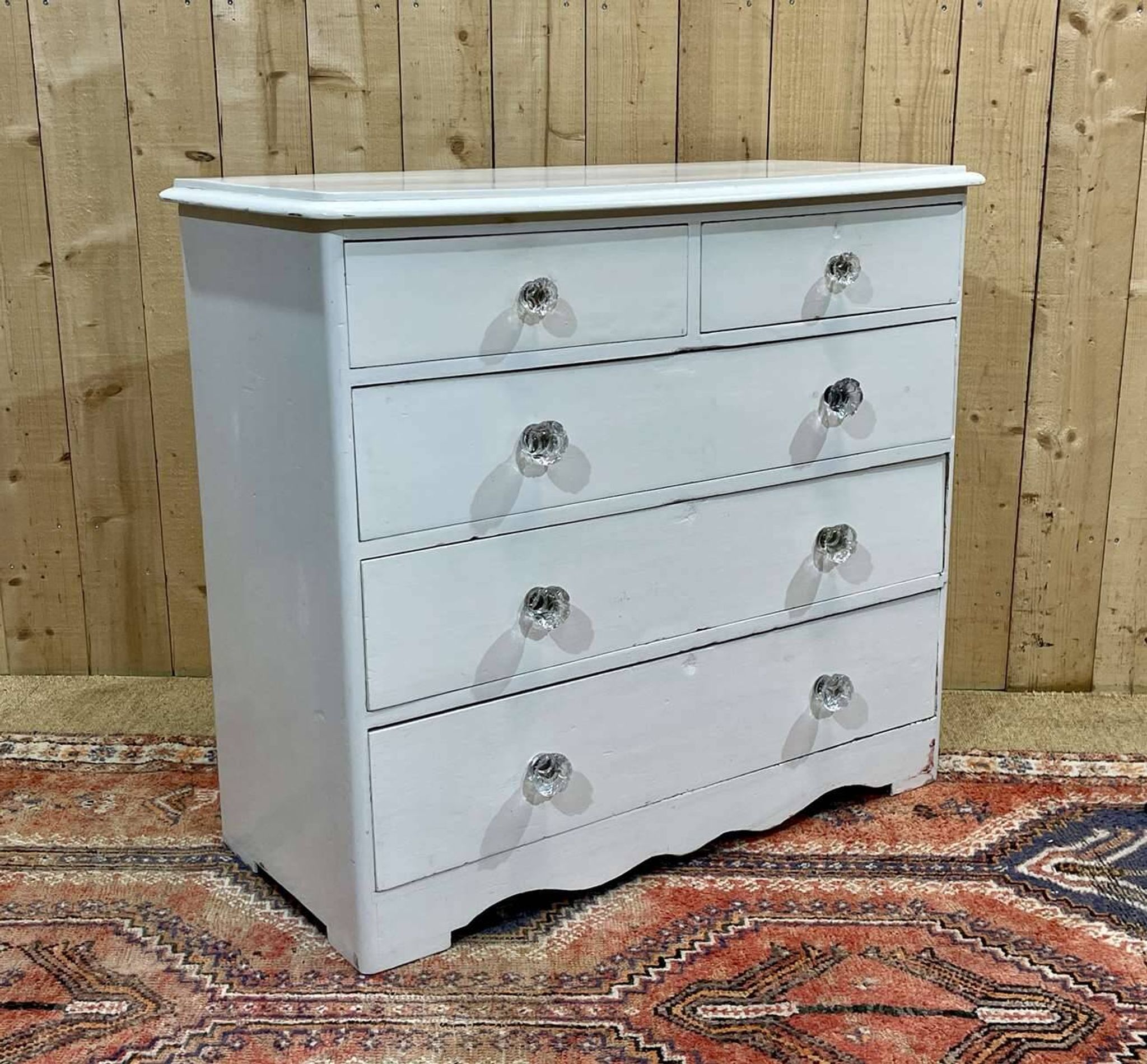 English chest of drawers painted in fir with glass knobs, 19th century