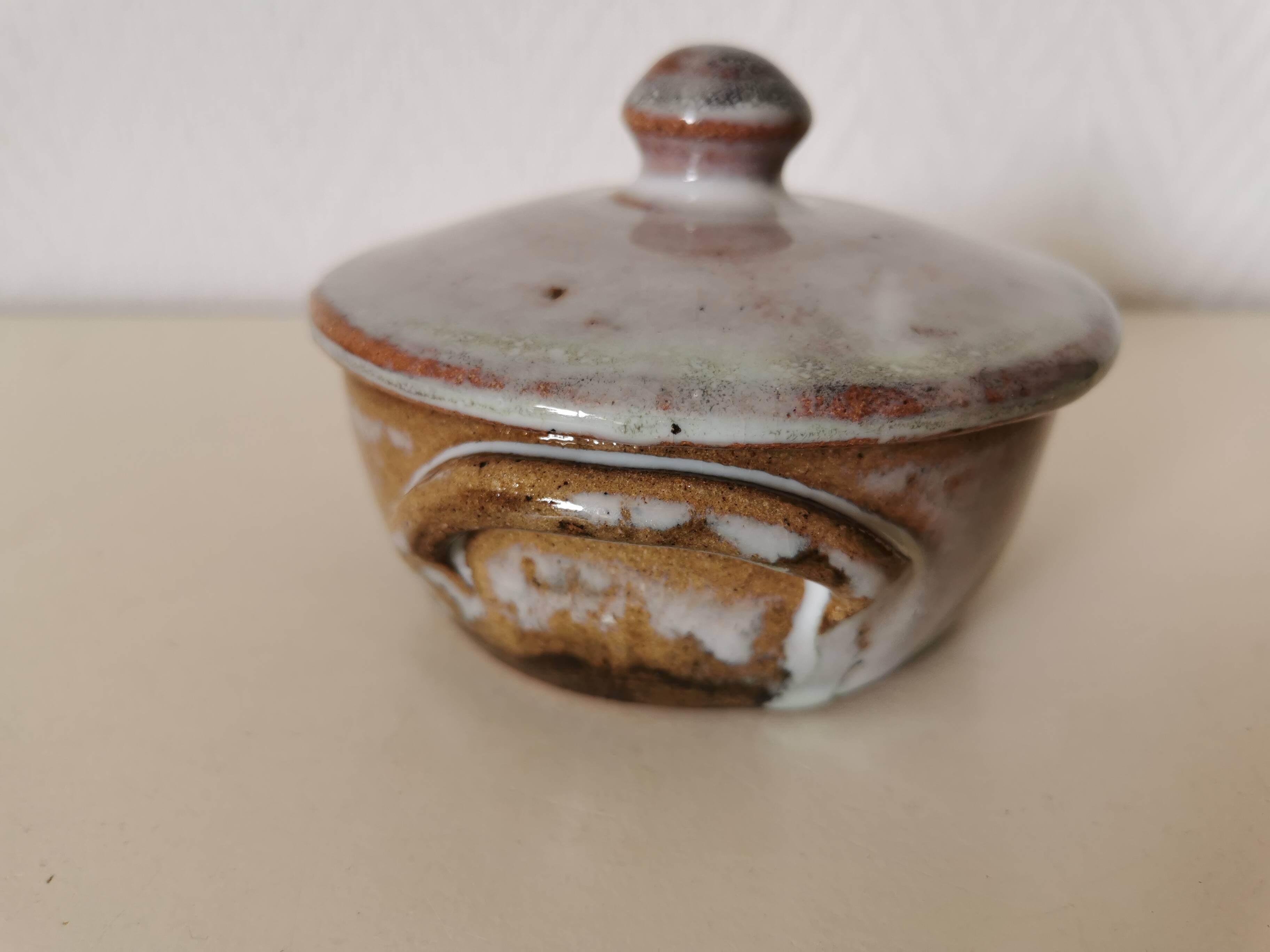 brown and white glazed stoneware sugar bowl