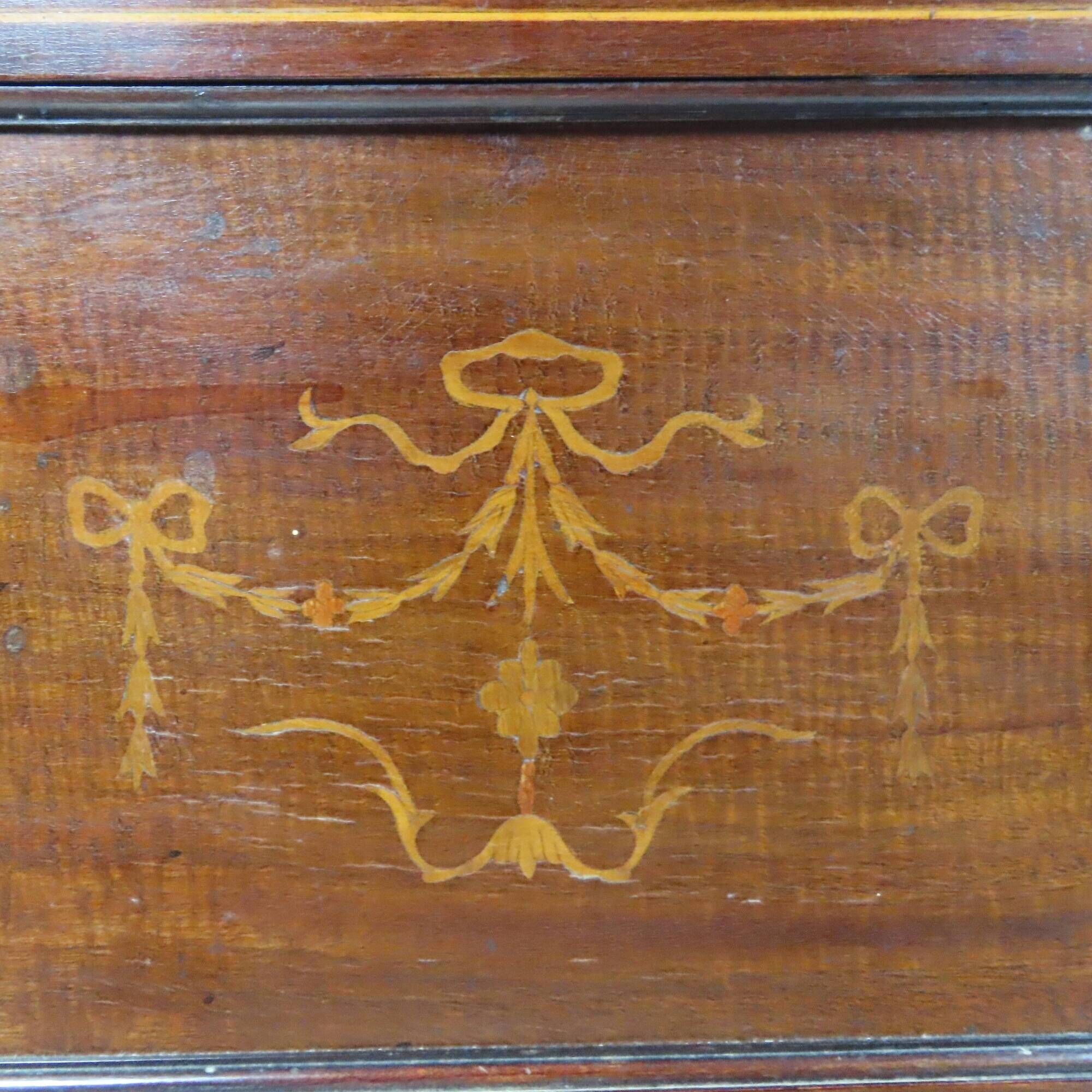 Antique English display cabinet. Marquetry with floral patterns and ribbons.