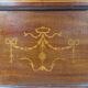Antique English display cabinet. Marquetry with floral patterns and ribbons.