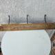 antique coat rack with 3 cast iron hooks