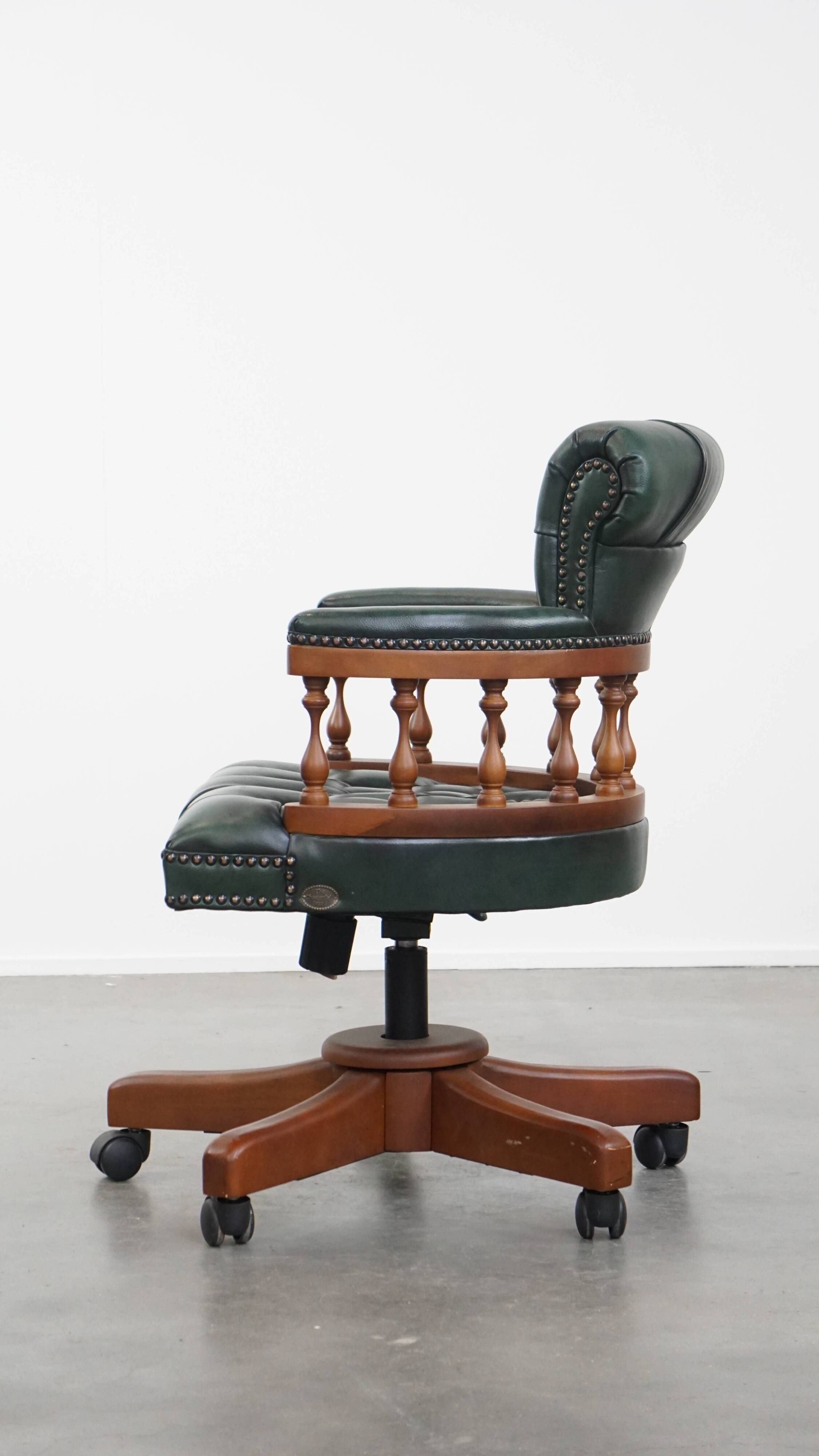 Dark green chesterfield office chair in cowhide leather on wheels