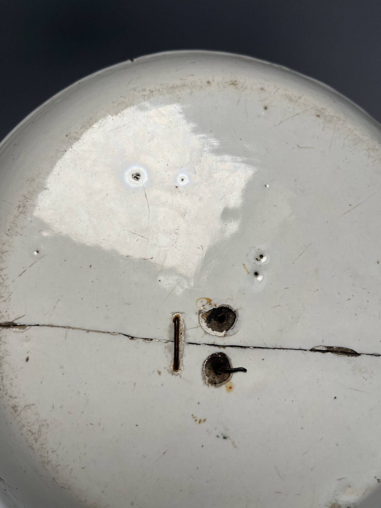 Two antique 18th-century faience plates, stapled.