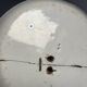 Two antique 18th-century faience plates, stapled.