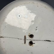 Two antique 18th-century faience plates, stapled.