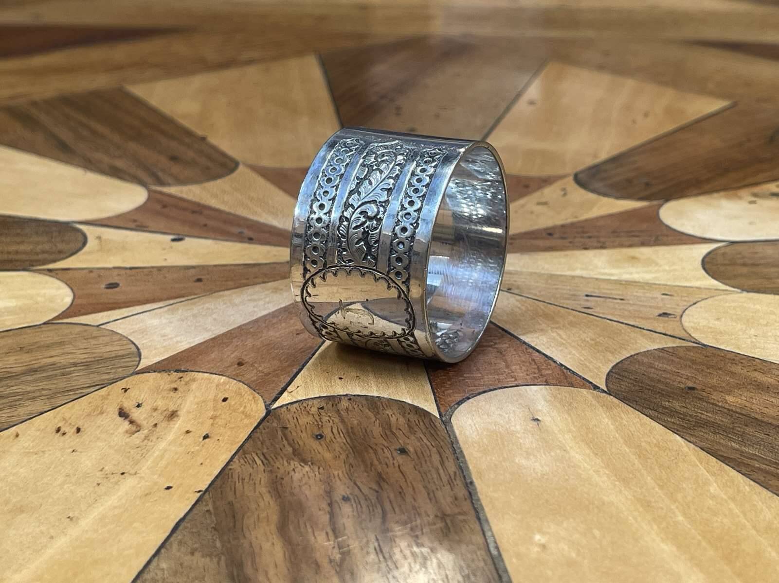 Silver metal napkin ring with the letter J