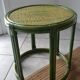 Green rattan side table.