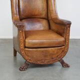 Characteristic antique sheepskin leather armchair with beautiful details and a unique design