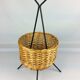 Black metal rattan trash can on 1960