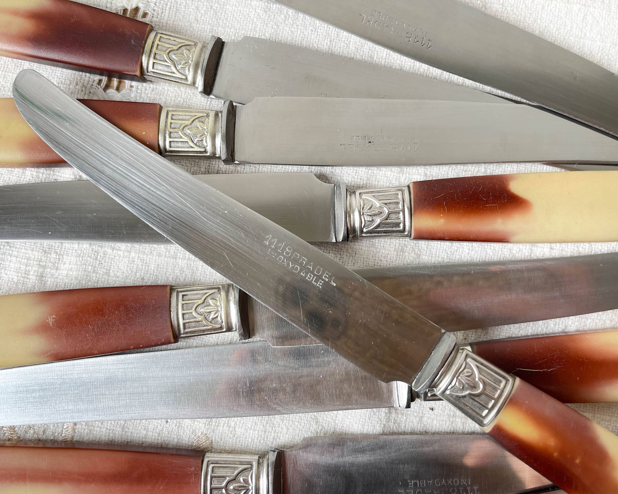 12 vintage Pradel stainless steel bakelite knives