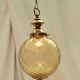 Amber glass suspension with brass