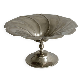 large dish on a shiny metal stand