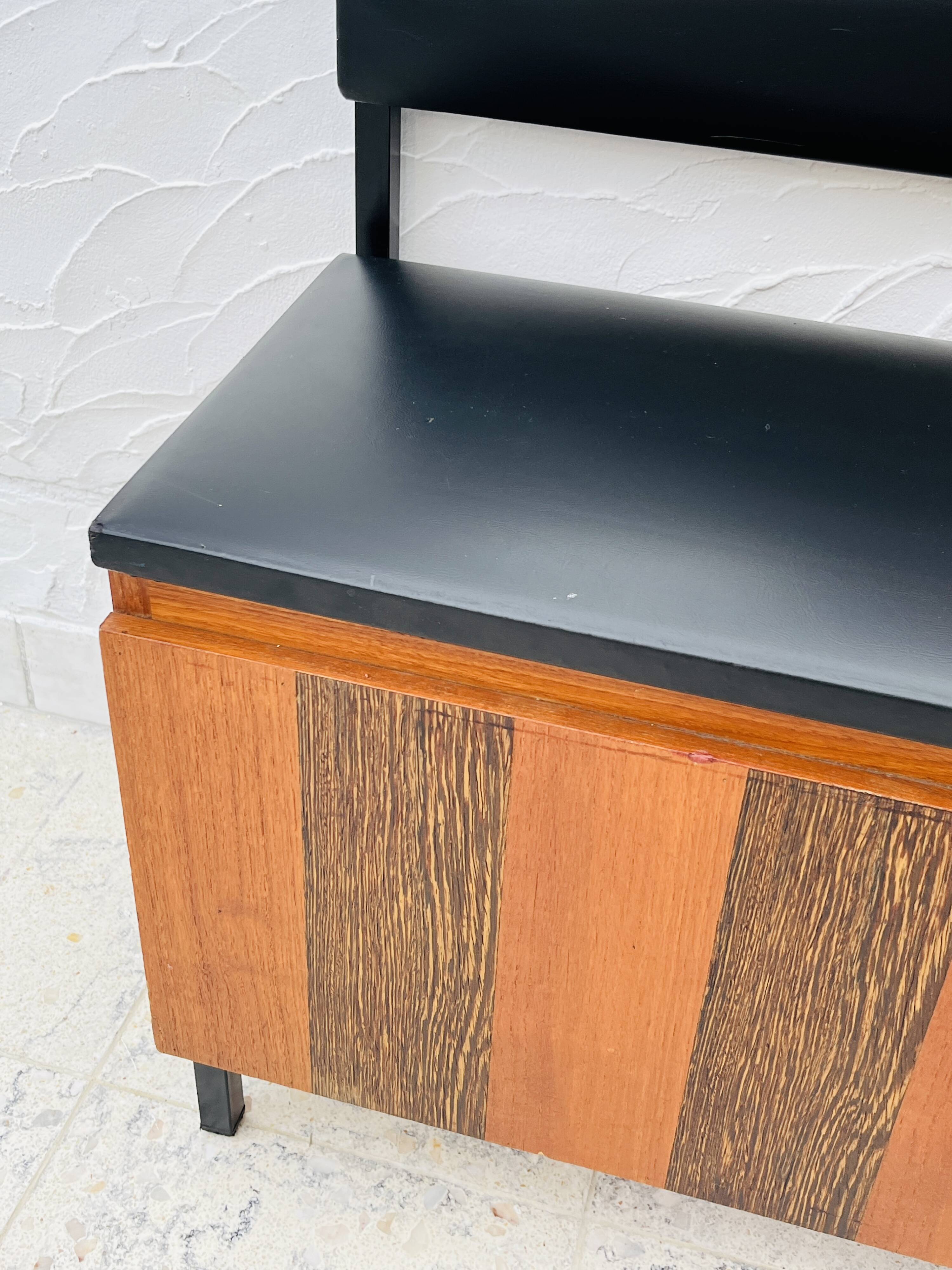 Vintage wall coat rack with storage bench from the 1970s.