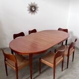 Round teak table with Scandinavian design extensions from the 60s vintage
