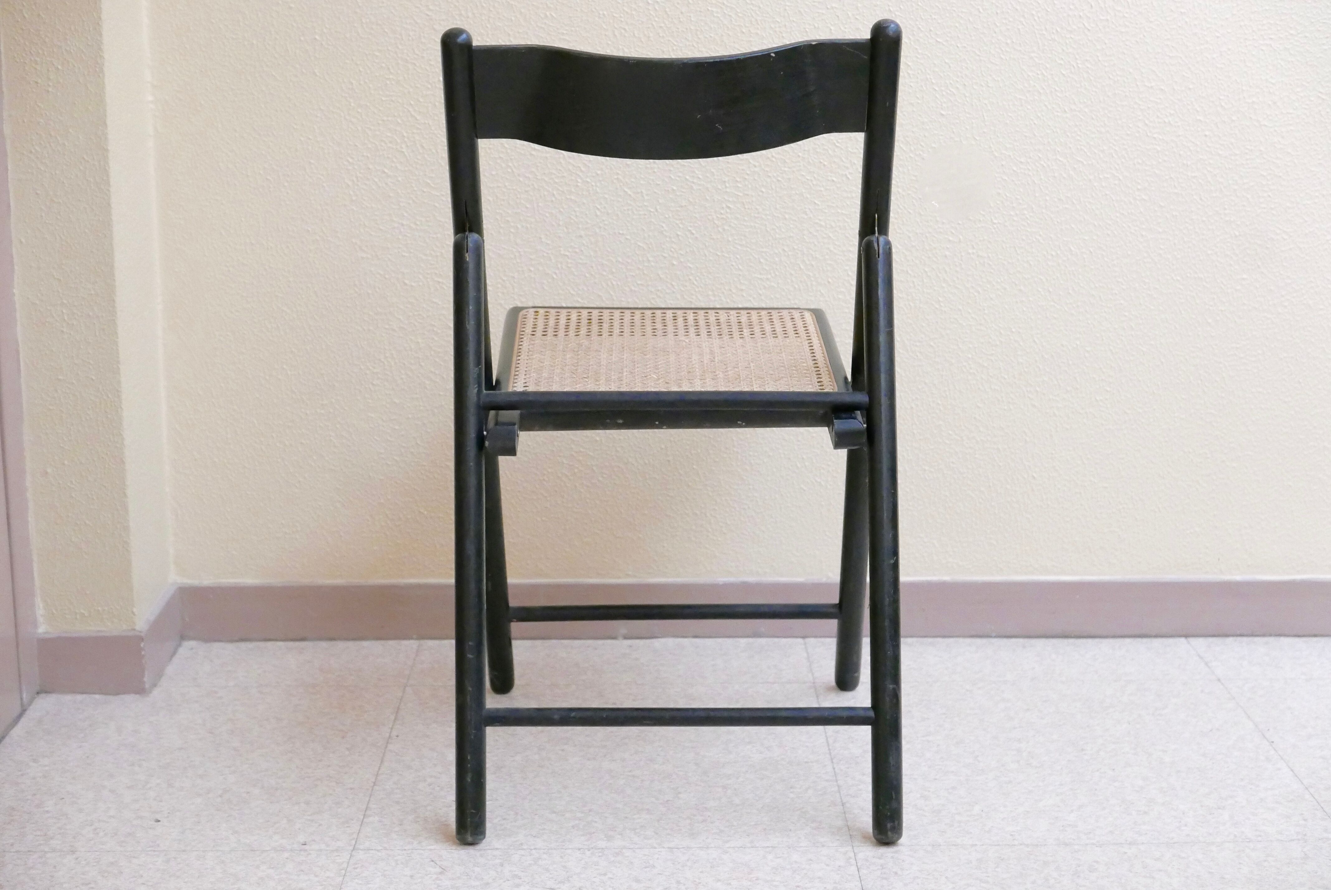 Black folding chair, 70s