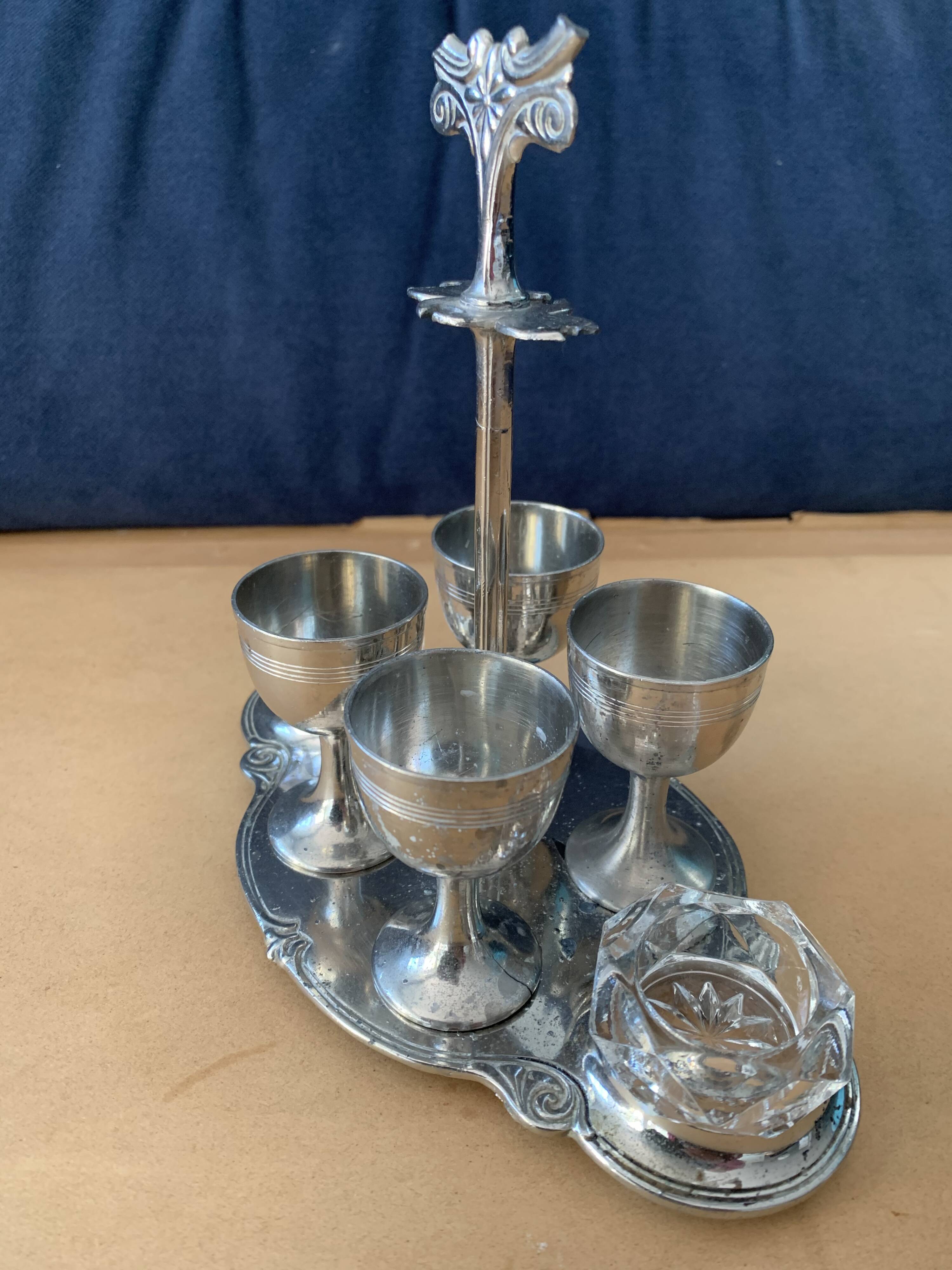 Old serving for boiled eggs with 4 metal cockroaches