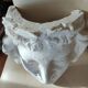Old face in plaster antique decoration