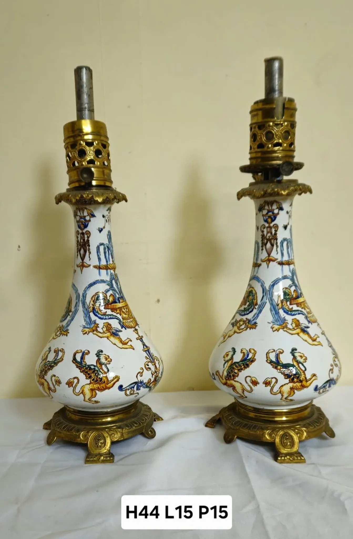 Gien: pair of antique oil lamps in fine earthenware richly decorated.
