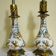 Gien: pair of antique oil lamps in fine earthenware richly decorated.