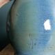 Enamel pitcher in pastel blue and green, signed