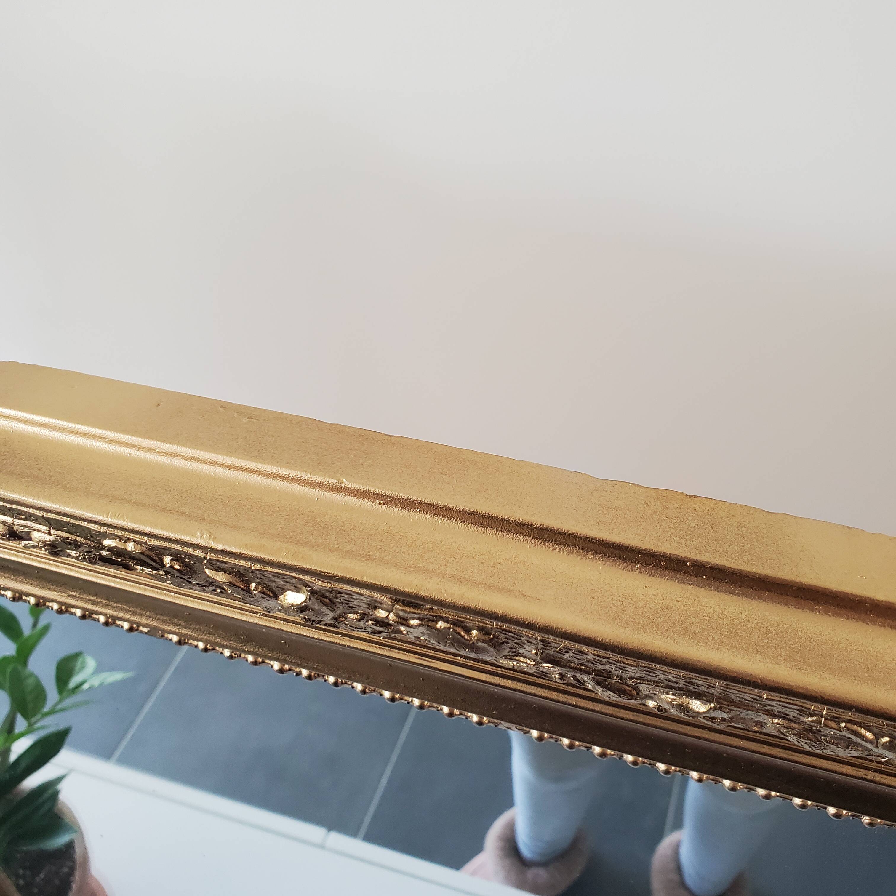 Antique mirror with gilded wood crests