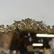 Golden metal pediment mirror from the 2000s.