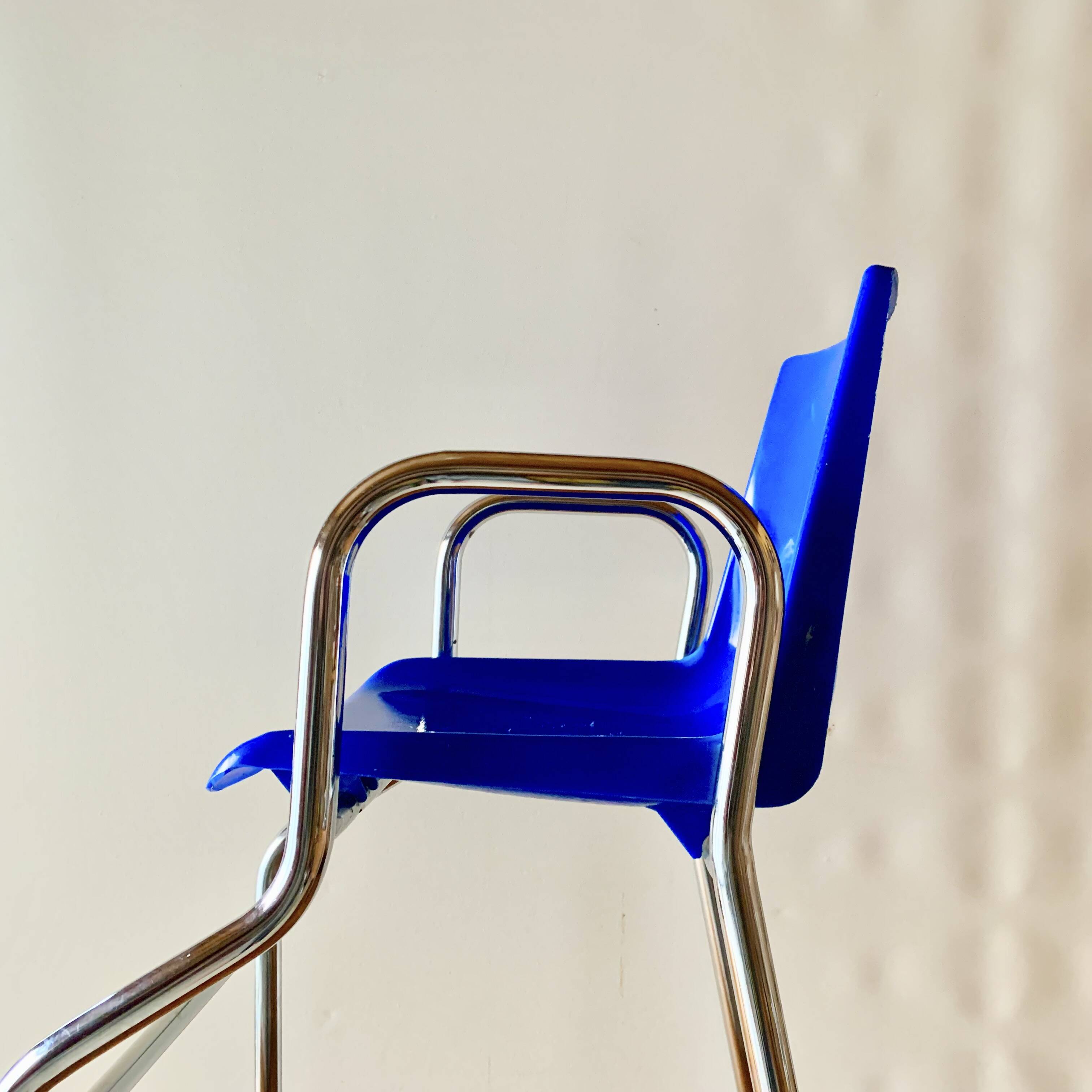 Vintage high chair for children in chrome metal and blue plastic