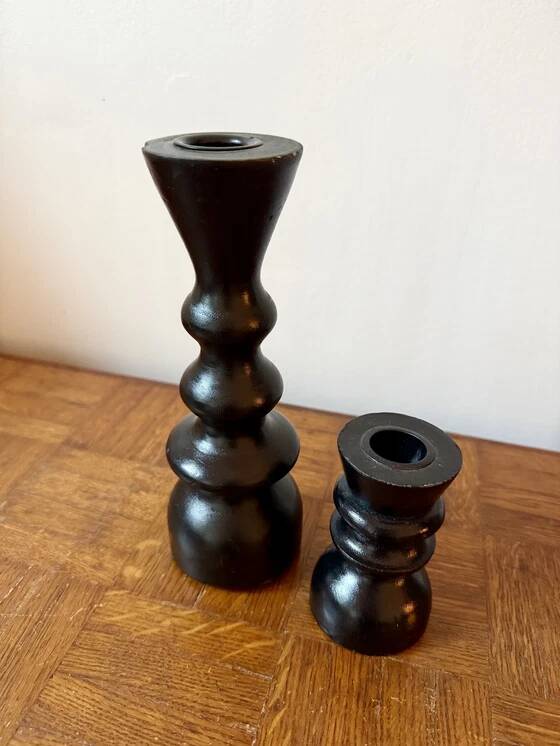 Pair of black turned wood candlesticks