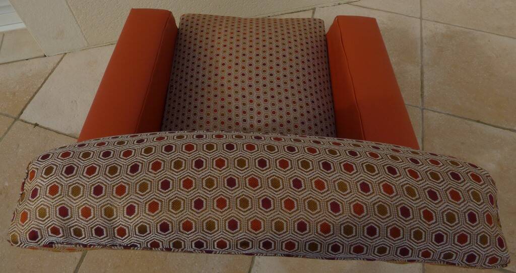 Retro vintage rockabilly armchair in orange faux leather and vintage fabrics