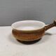 Small ceramic bowl with handle, in golden colours. Danish 1960-70s
