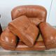 2 fauteuils en cuir cognac, années 1970