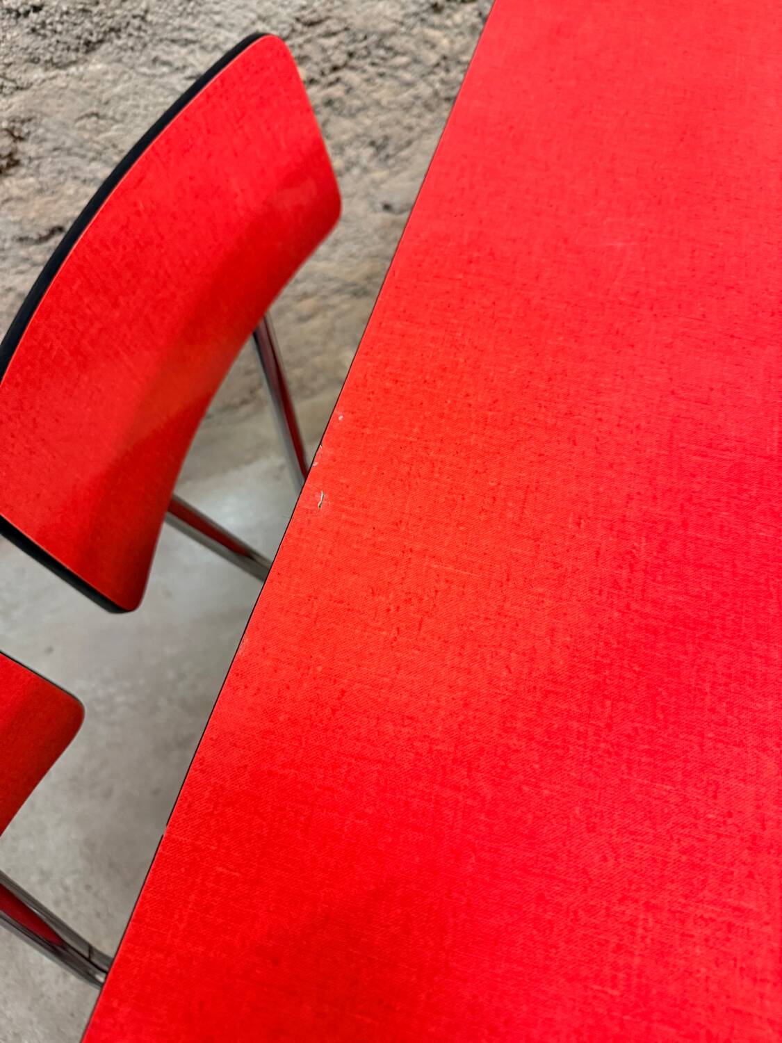 4 red Formica chairs with a 1970s table