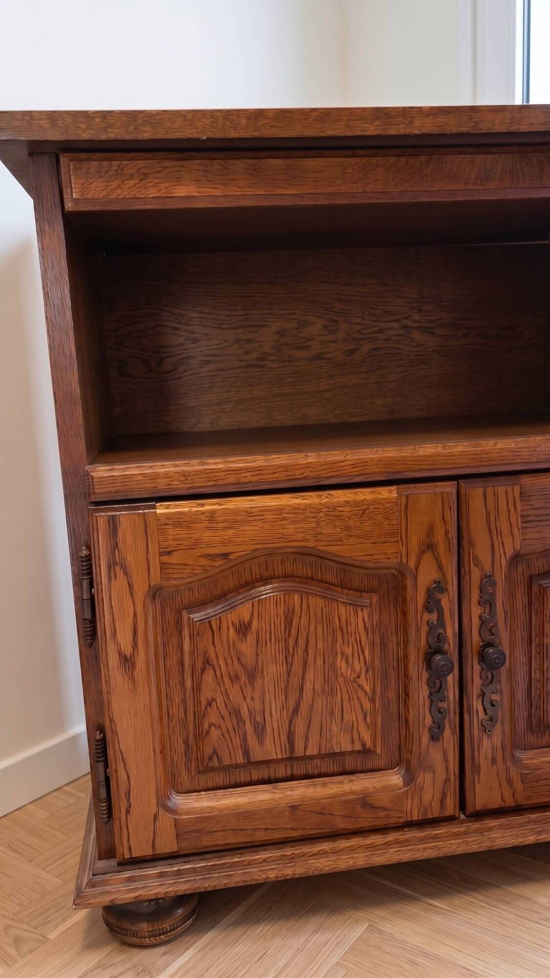 Traditional antique TV cabinet made of solid wood.