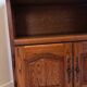 Traditional antique TV cabinet made of solid wood.