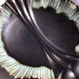 Undulating black iridescent ceramic cut