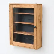 Antique wall display cabinet in natural wood and black – small glass-fronted collector's piece.