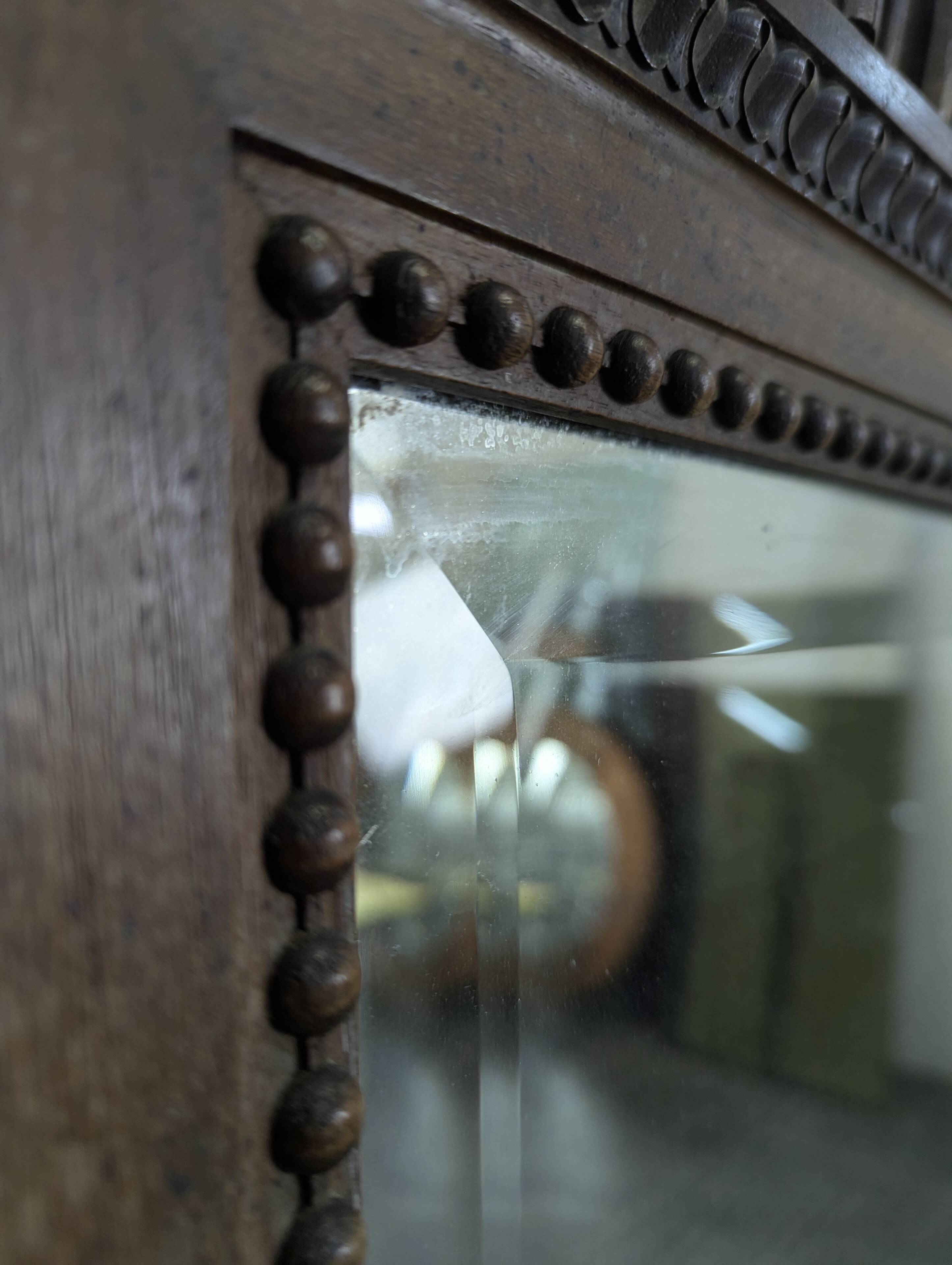Louis XVI style mirror in carved walnut.