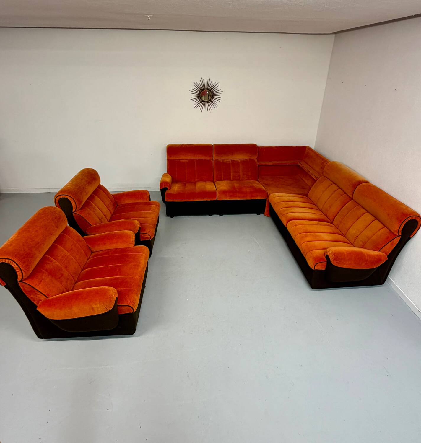 Modular vintage orange corner sofa, 1970s pop design.
