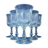 Suite of six white wine glasses on colorless glass stand