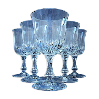 Suite of six white wine glasses on colorless glass stand