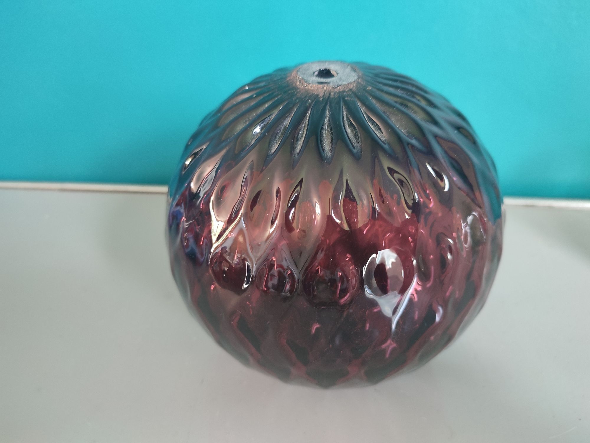 Old plum color blown glass ball