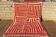 Handmade traditional orange and white Beni Ourain rug.