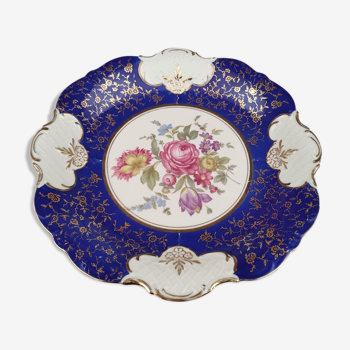 Plat rond creux en porcelaine allemande bleu nuit et motifs floraux polychromes et dorés