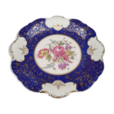 Hollow round dish in midnight blue German porcelain and polychrome and golden floral motifs
