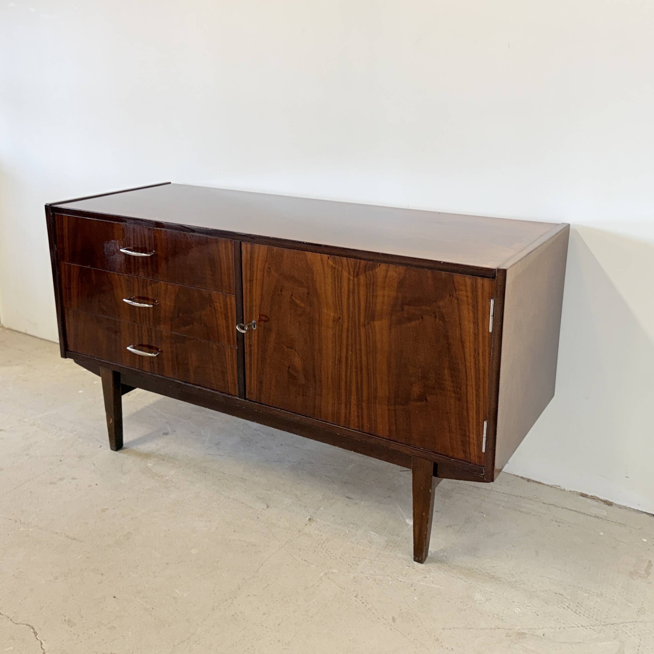 Subtle high-gloss sideboard in Scandinavian style
